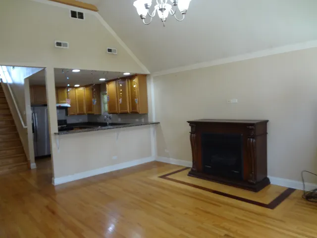 a view of living room with a fireplace and furniture