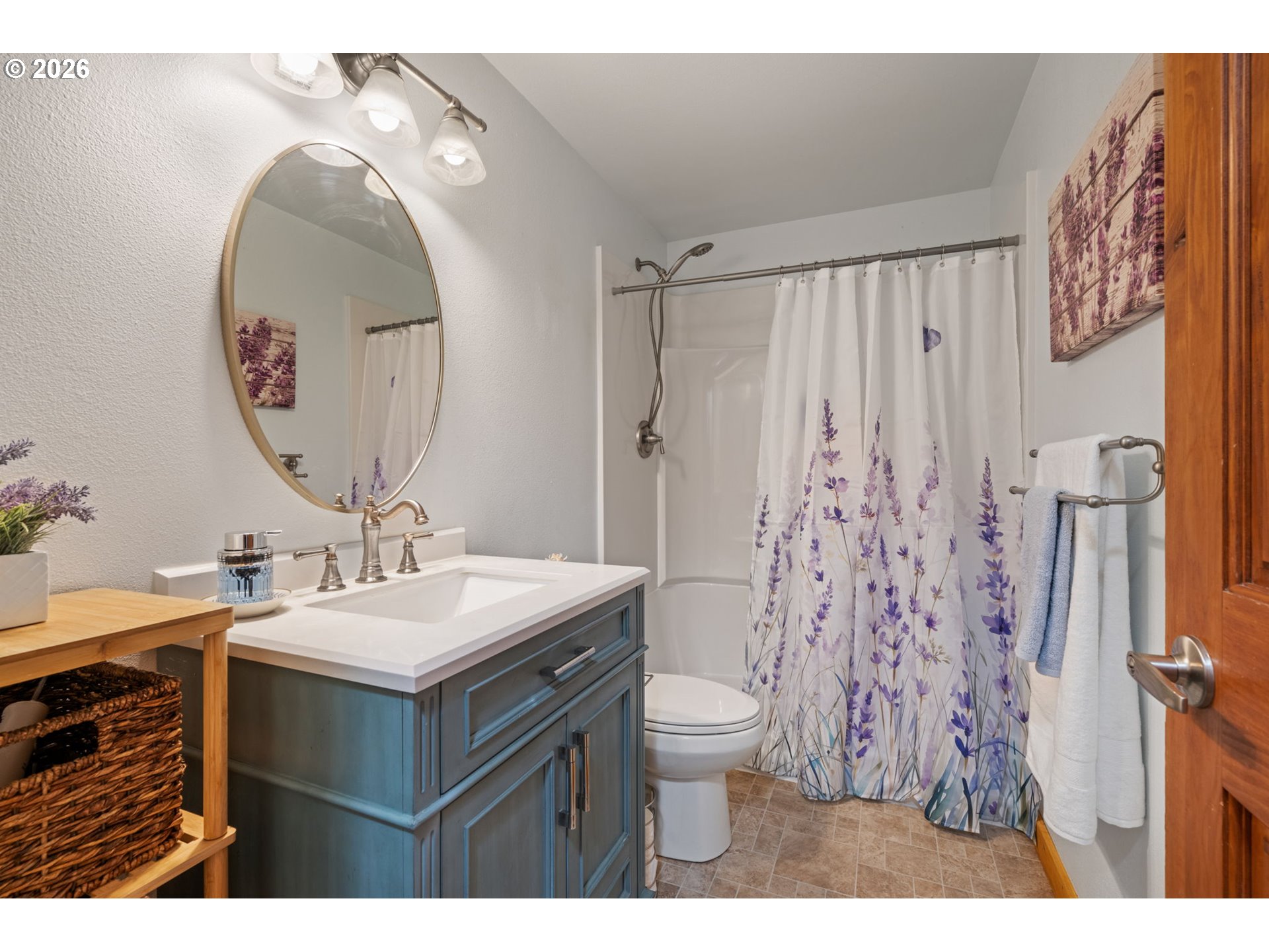 38220 Northeast Sunset Falls Road Yacolt, WA 98675 - Photo 16 of 40 a bathroom with a sink mirror and a toilet