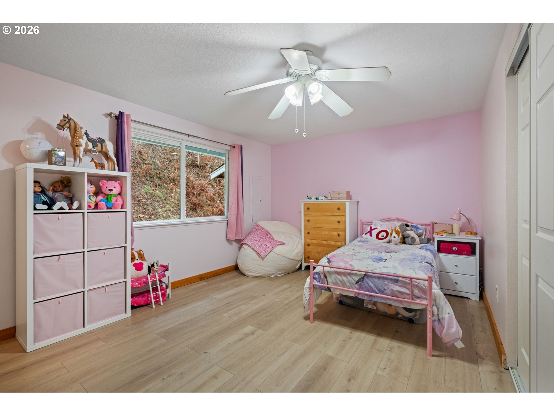 38220 Northeast Sunset Falls Road Yacolt, WA 98675 - Photo 18 of 40 a bedroom with furniture and a chandelier