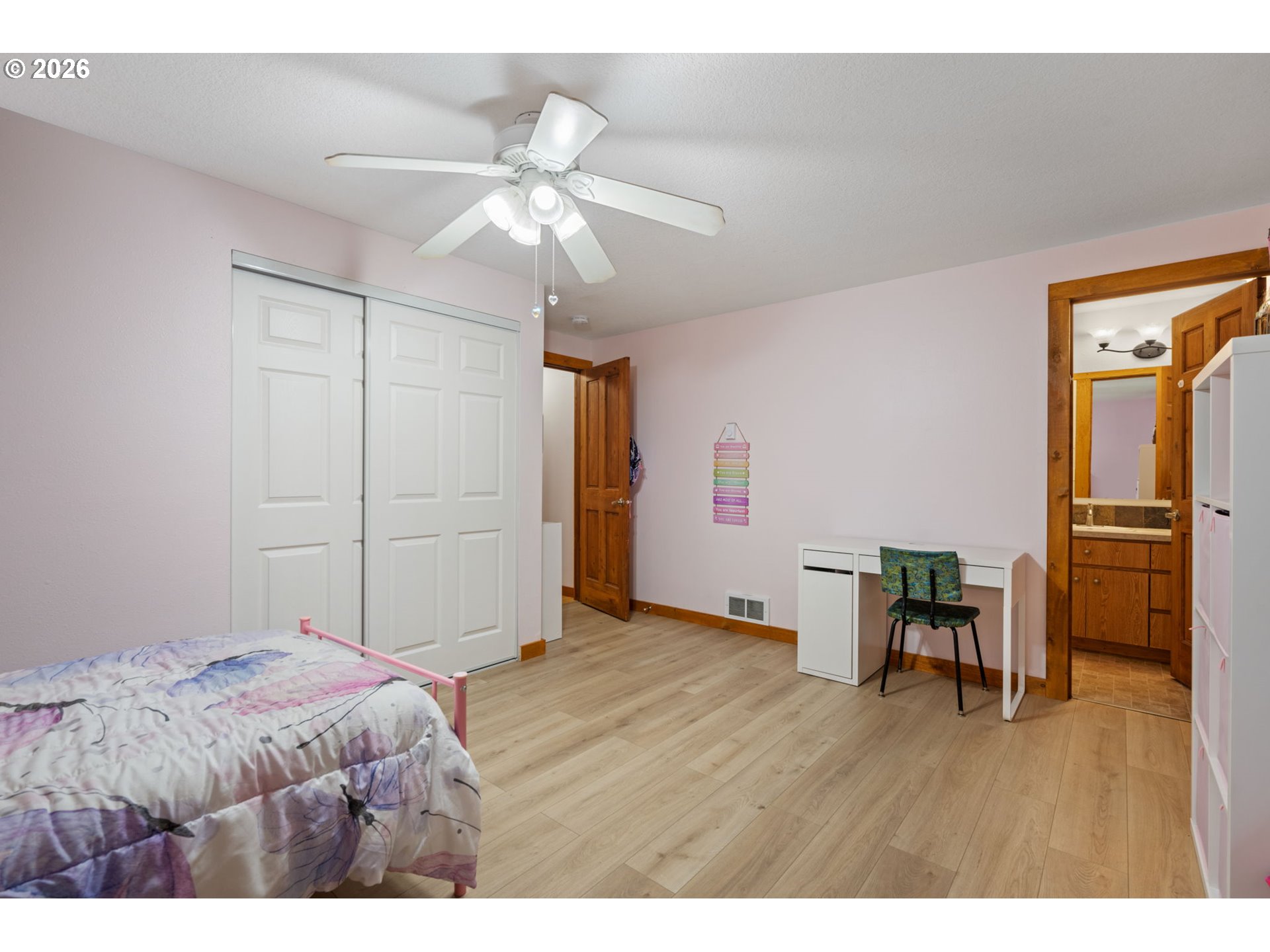 38220 Northeast Sunset Falls Road Yacolt, WA 98675 - Photo 19 of 40 a bedroom with a bed and a table