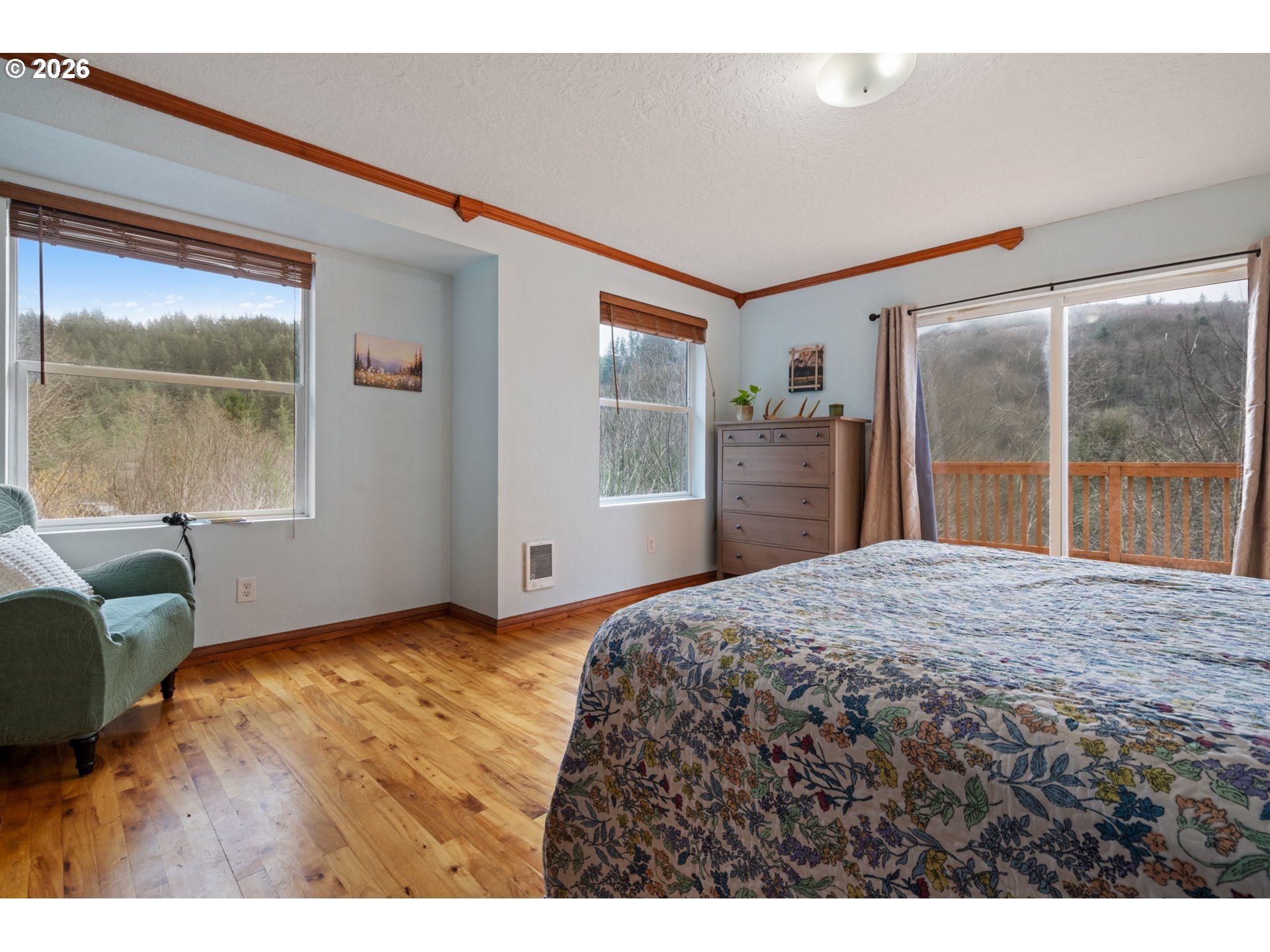 38220 Northeast Sunset Falls Road Yacolt, WA 98675 - Photo 23 of 40 a bedroom with a bed and a large window