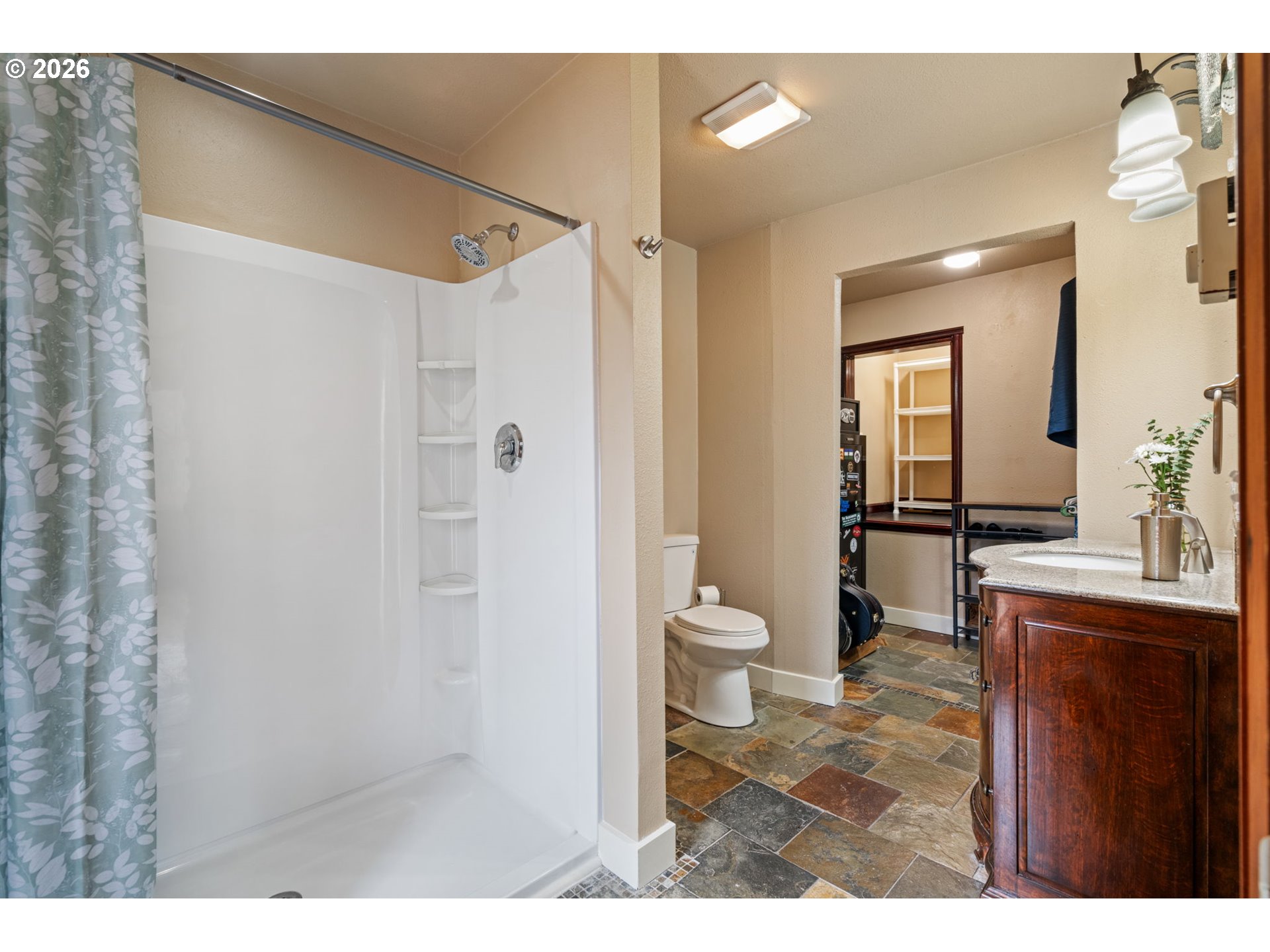 38220 Northeast Sunset Falls Road Yacolt, WA 98675 - Photo 25 of 40 a bathroom with a sink a toilet and shower
