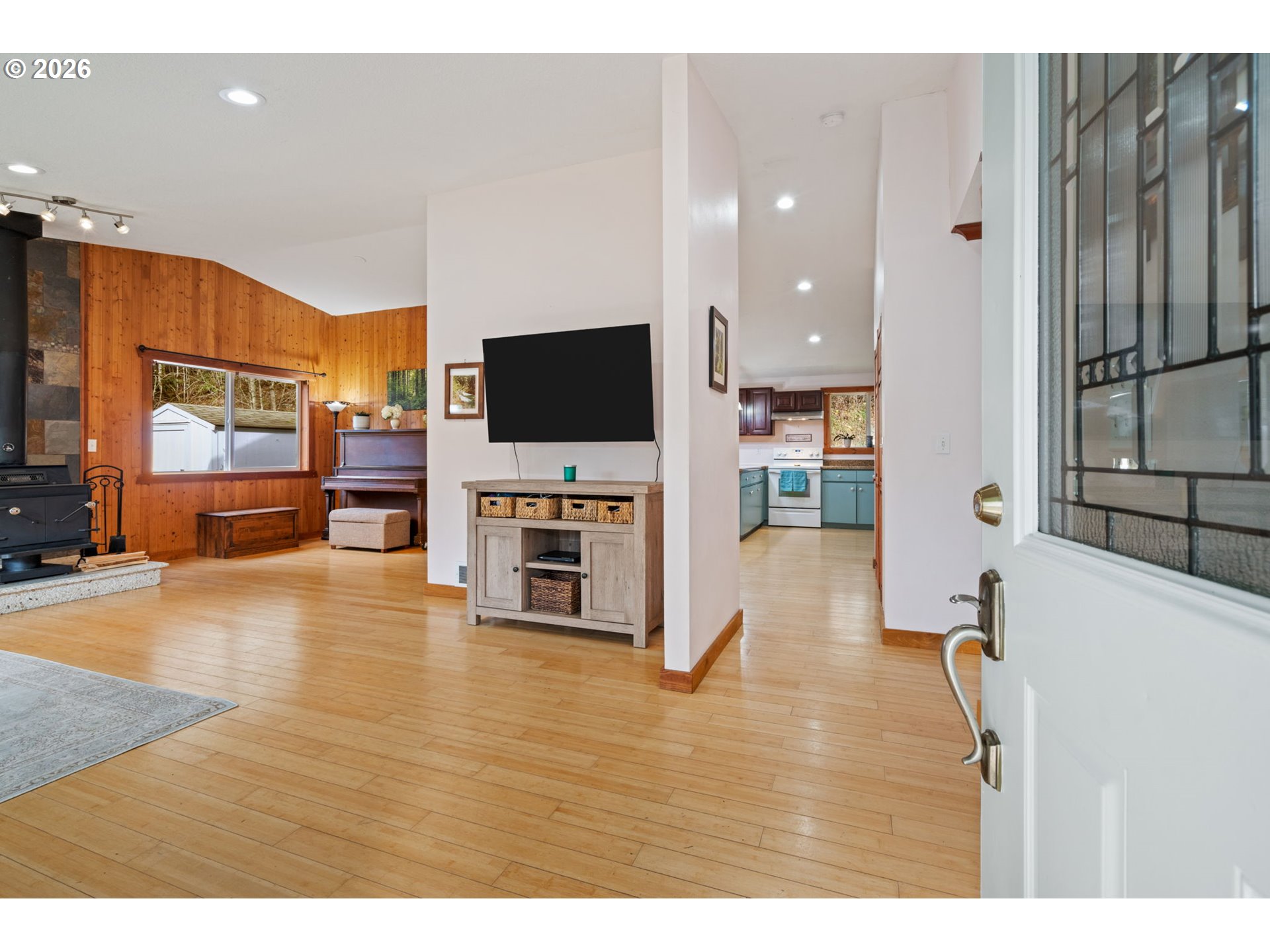38220 Northeast Sunset Falls Road Yacolt, WA 98675 - Photo 4 of 40 a living room with furniture and a flat screen tv