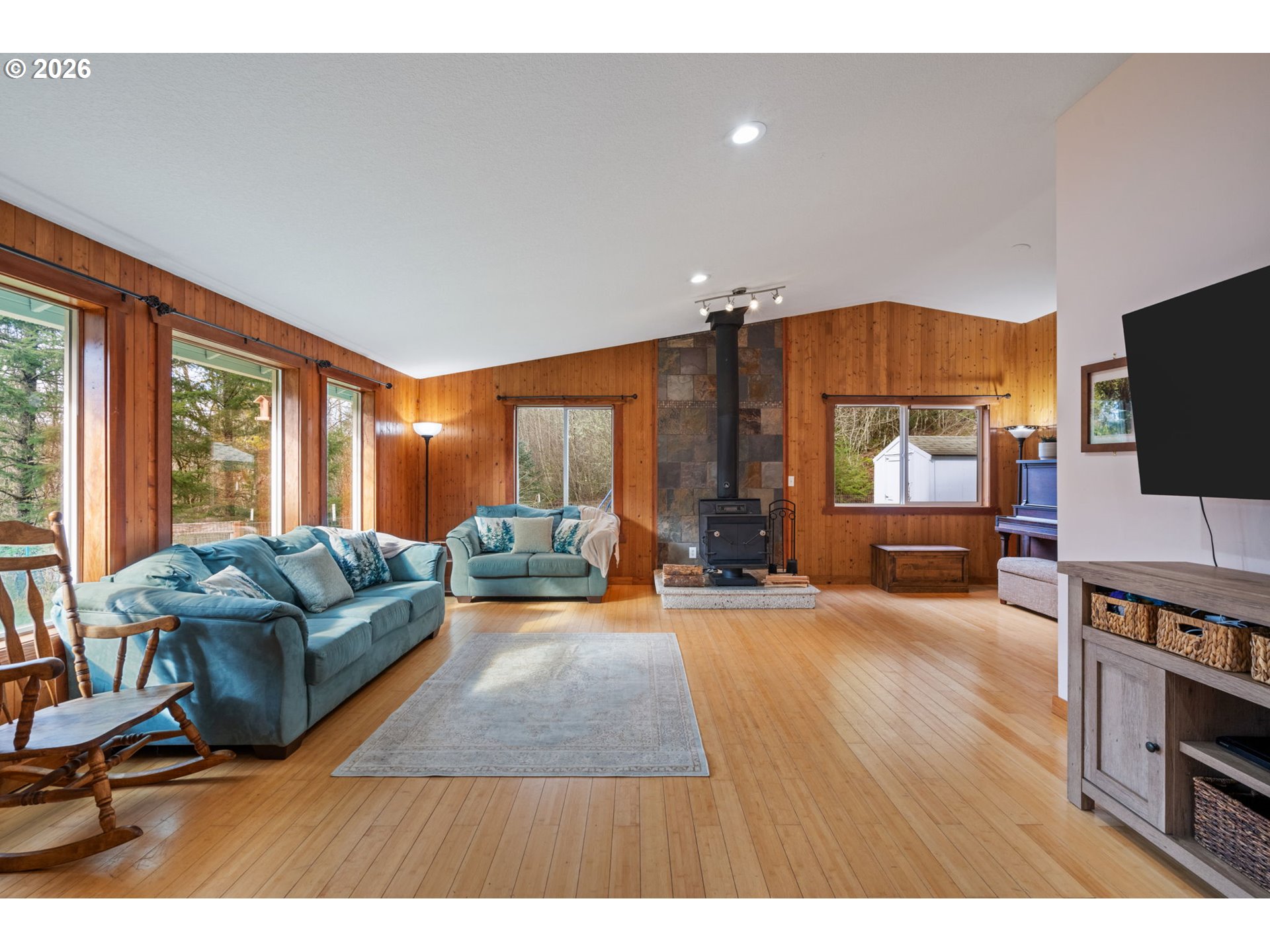 38220 Northeast Sunset Falls Road Yacolt, WA 98675 - Photo 5 of 40 a living room with furniture and a flat screen tv