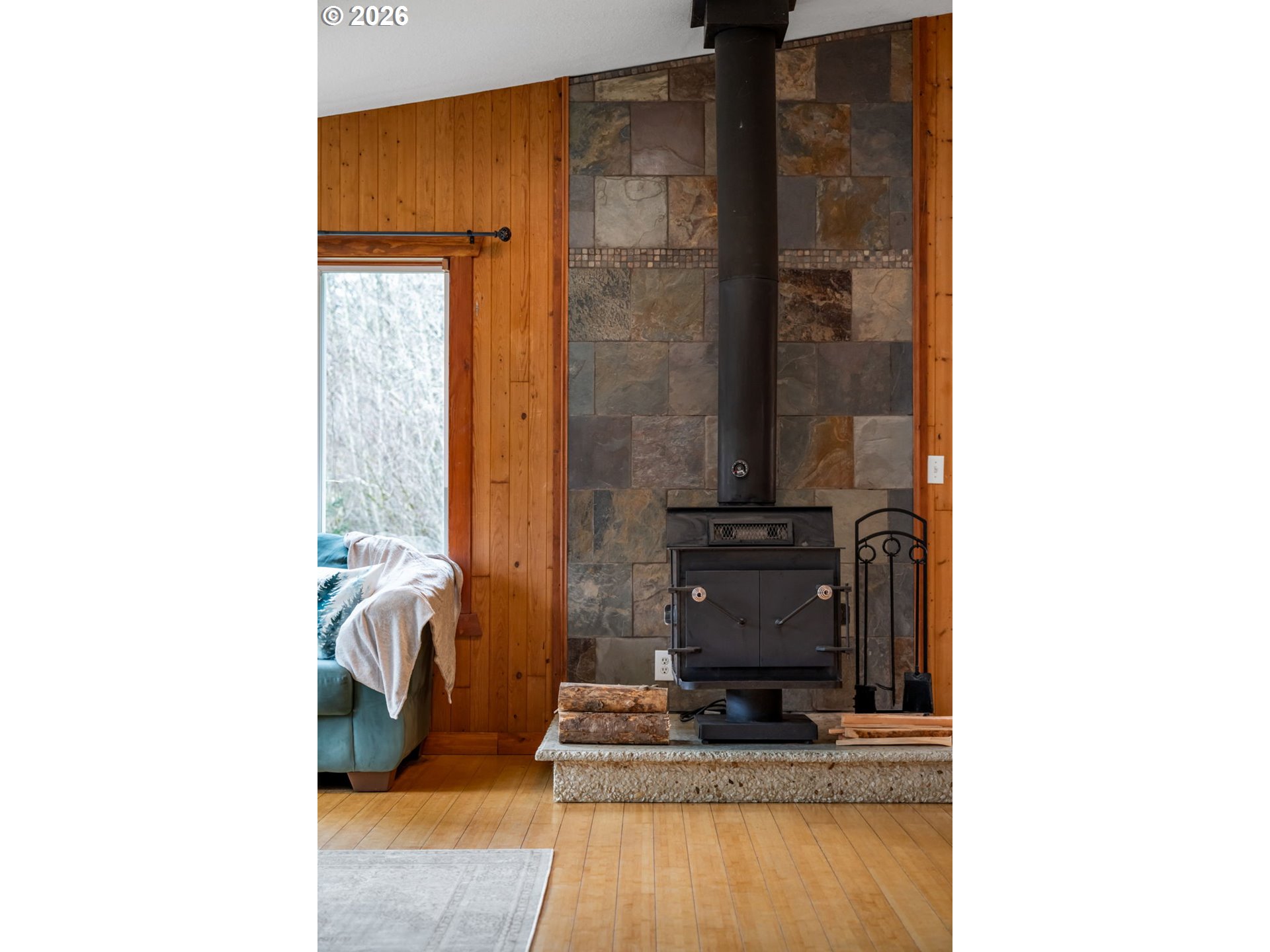 38220 Northeast Sunset Falls Road Yacolt, WA 98675 - Photo 6 of 40 a view of living room with a chair and frames on the wall