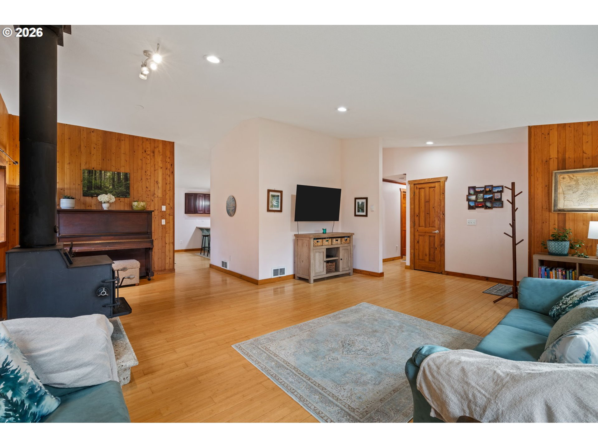 38220 Northeast Sunset Falls Road Yacolt, WA 98675 - Photo 10 of 40 a living room with furniture and a flat screen tv