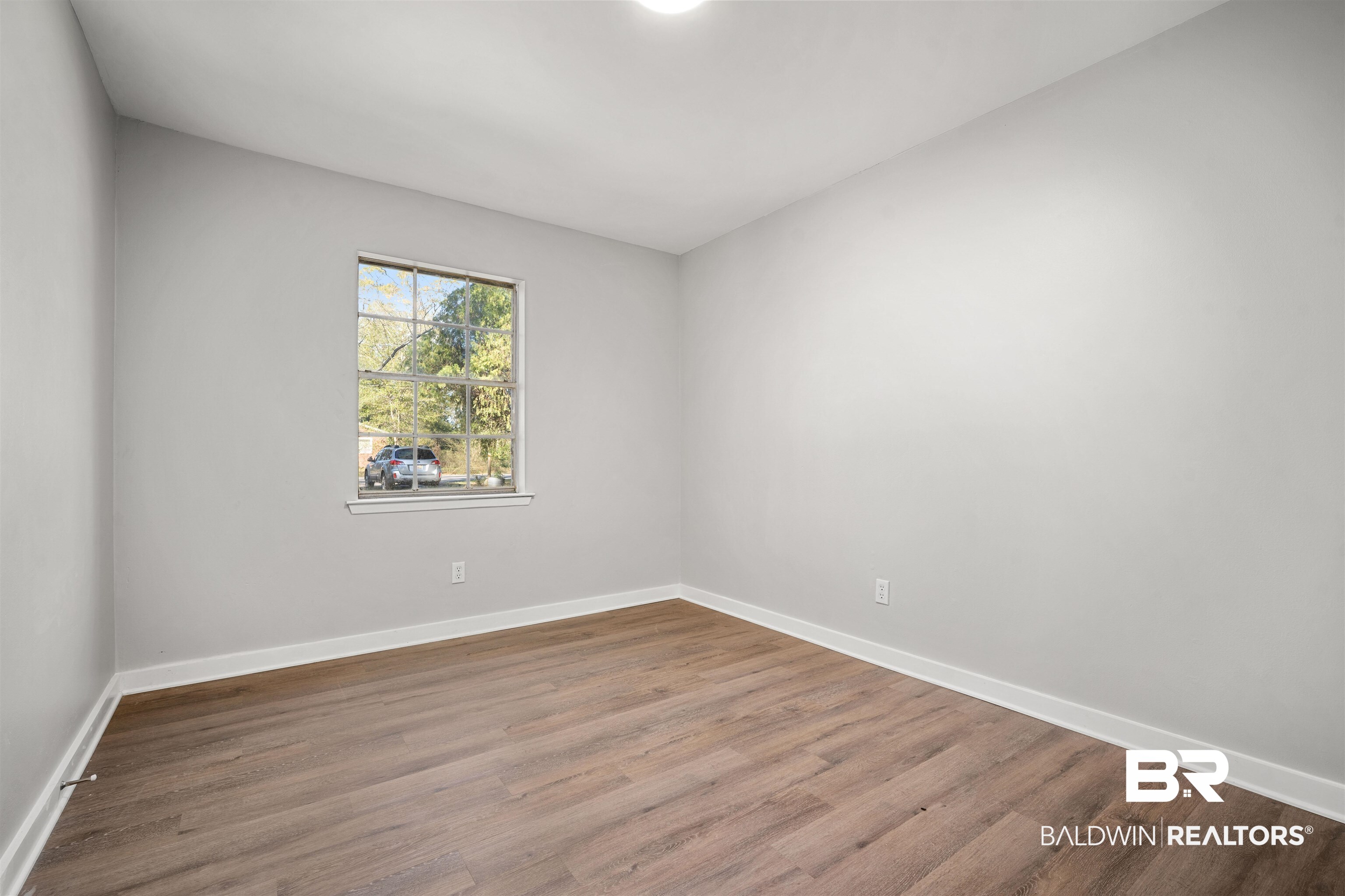 1368 Hubert Pierce Road Mobile, AL 36608 - Photo 16 of 25 Unfurnished room featuring wood finished floors and baseboards