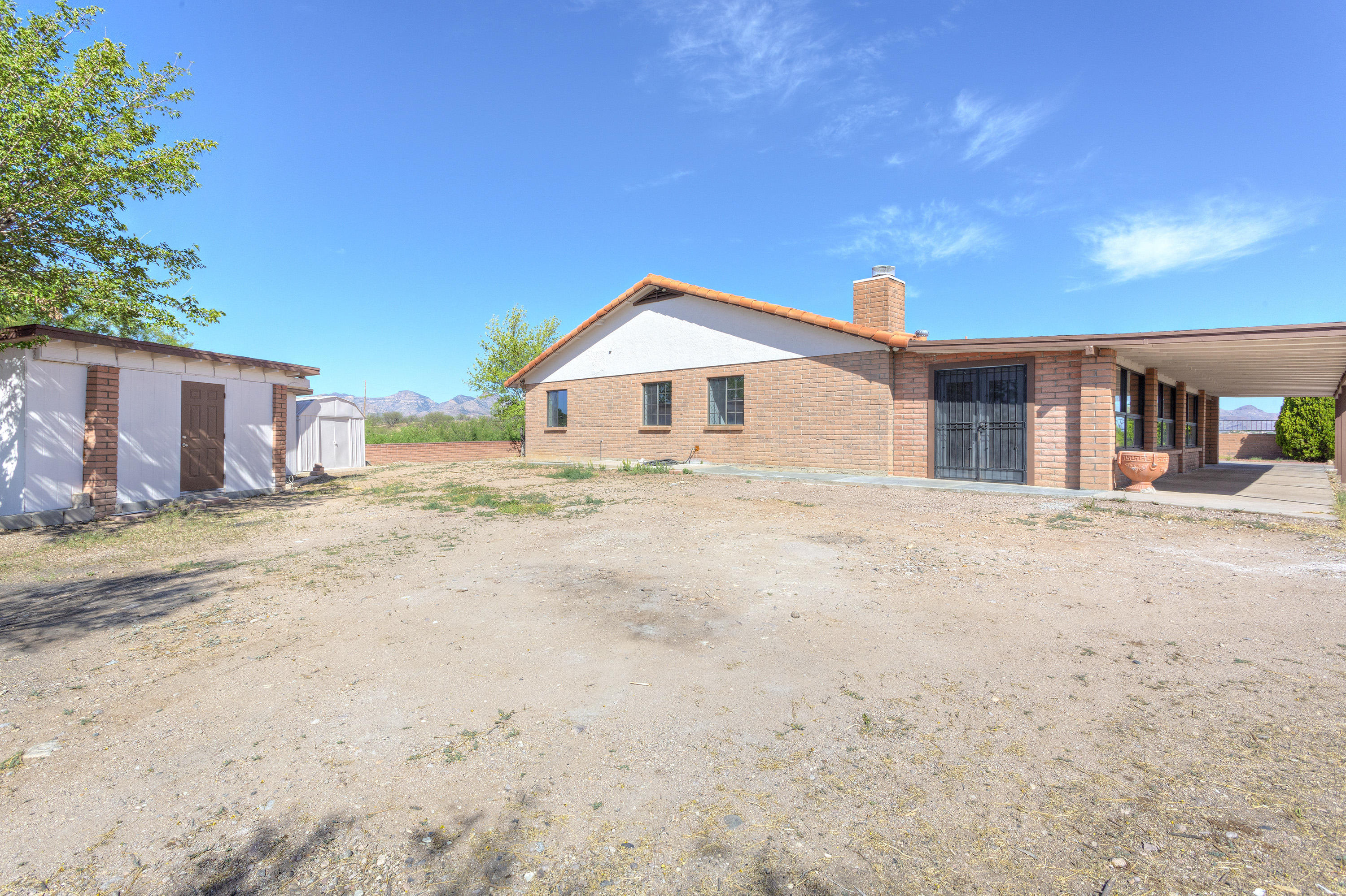 1096 Montosa Circulo Rio Rico, AZ 85648 - Photo 33 of 39 a front view of a house with a yard
