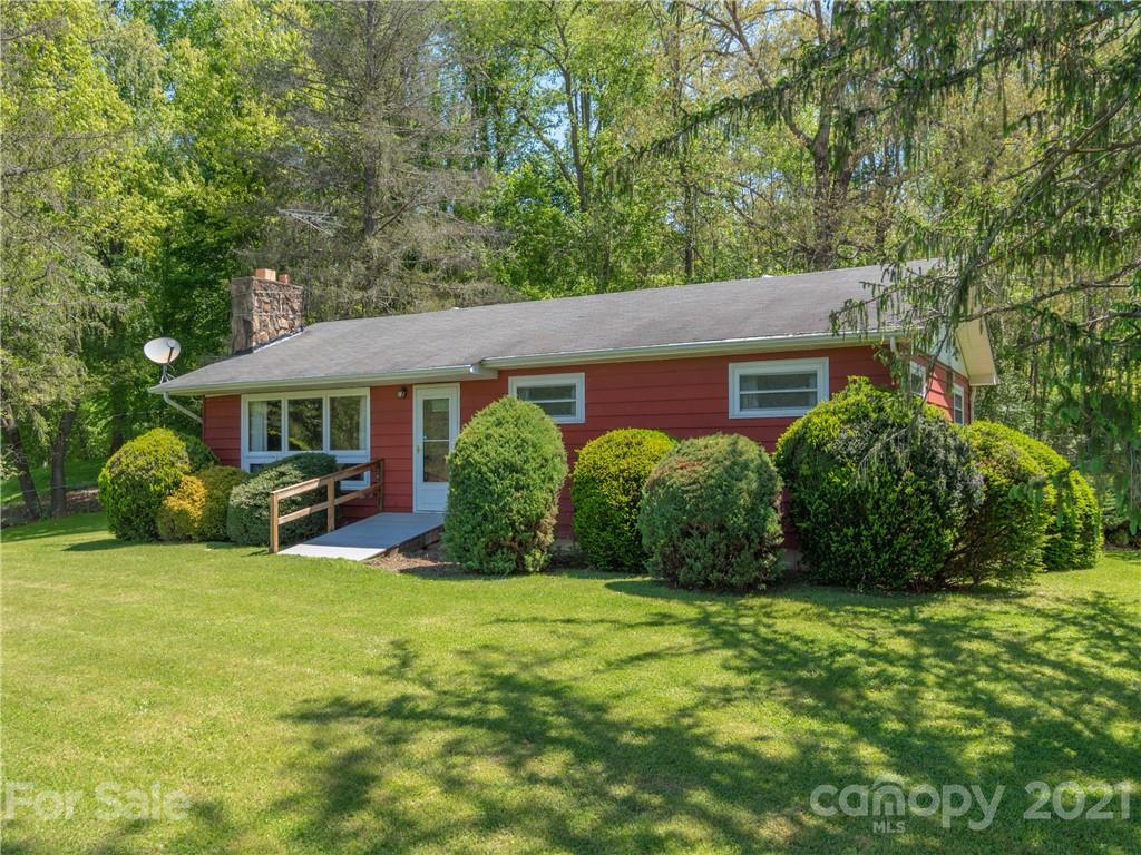 113 Possum Ridge Road Canton, NC 28716 - Photo 1 of 24 a view of a house with a yard and sitting area