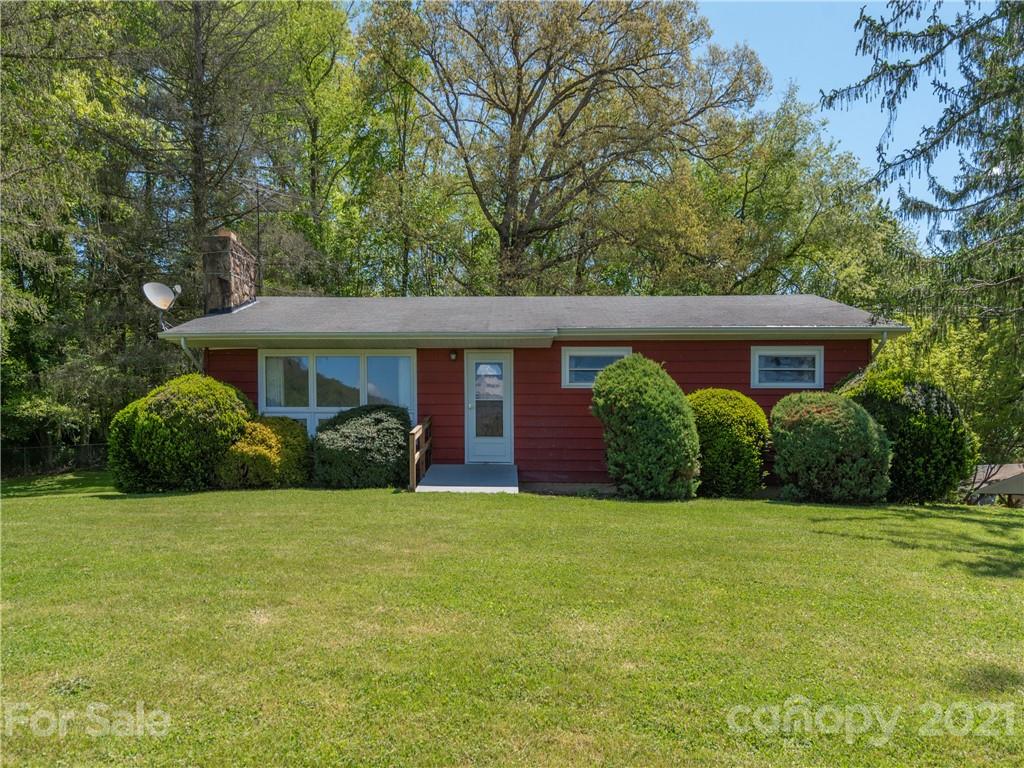 113 Possum Ridge Road Canton, NC 28716 - Photo 2 of 24 a view of a house with backyard and porch