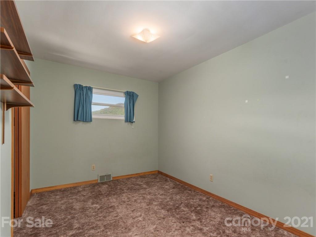113 Possum Ridge Road Canton, NC 28716 - Photo 12 of 24 an empty room with windows