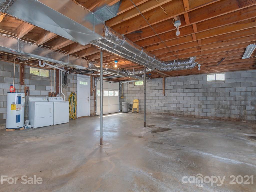 113 Possum Ridge Road Canton, NC 28716 - Photo 15 of 24 a view of a storage room with windows