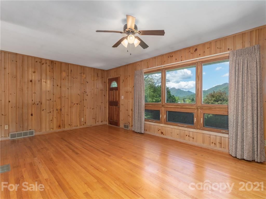 113 Possum Ridge Road Canton, NC 28716 - Photo 3 of 24 a view of an empty room with a window