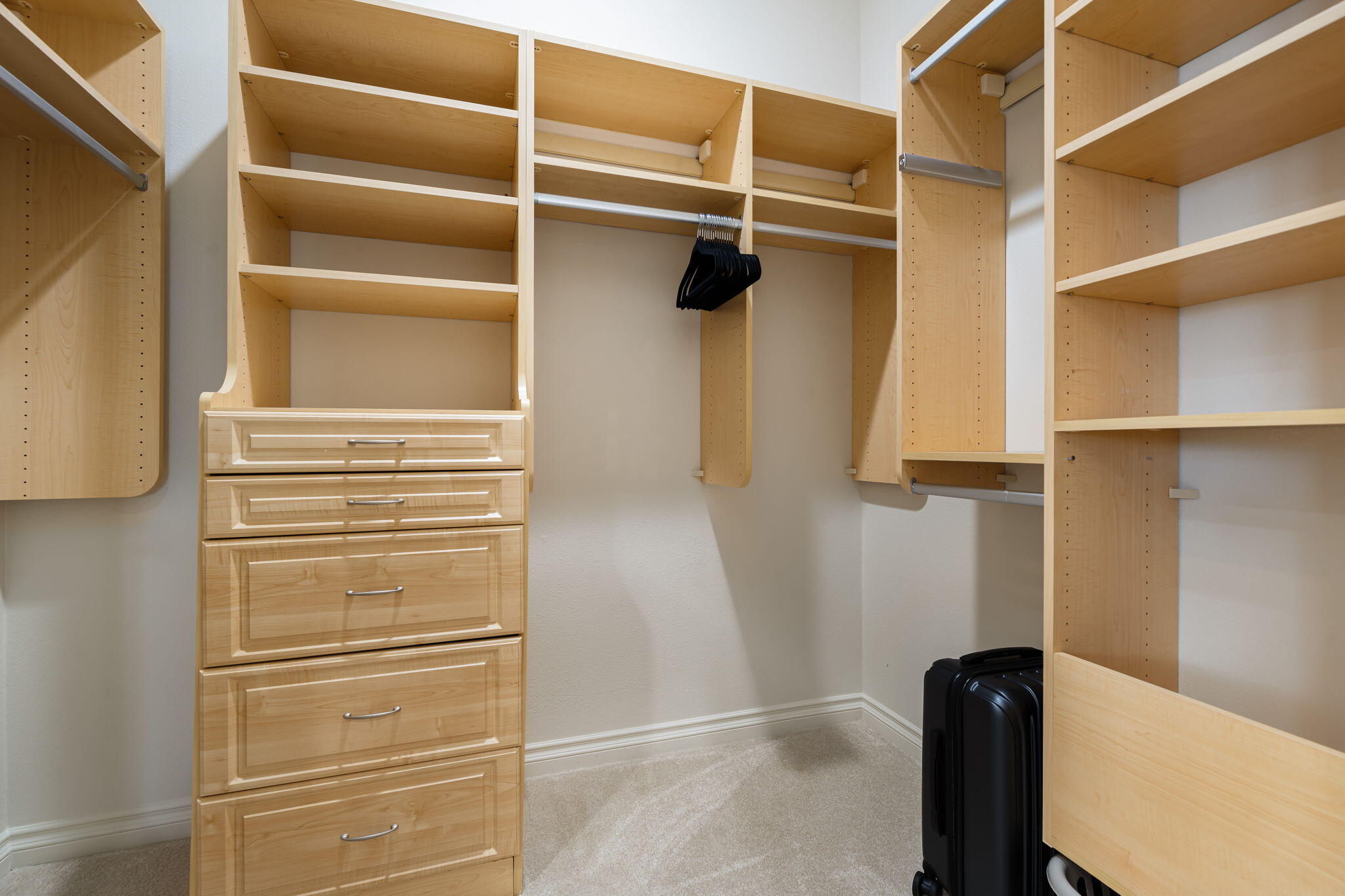 52455 Whispering Way La Quinta, CA 92253 - Photo 12 of 18 a view of walk in closet with empty racks