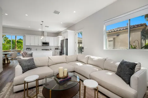 a kitchen with stainless steel appliances a refrigerator sink and microwave
