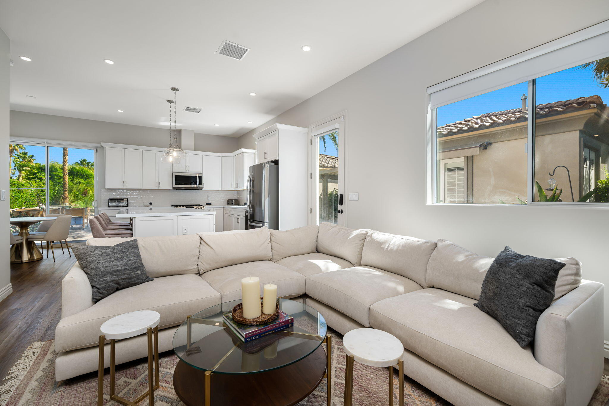 52455 Whispering Way La Quinta, CA 92253 - Photo 14 of 18 a living room with furniture kitchen and a chandelier