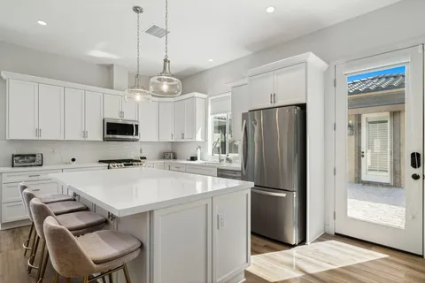 a view of living room kitchen with a sink and a couch