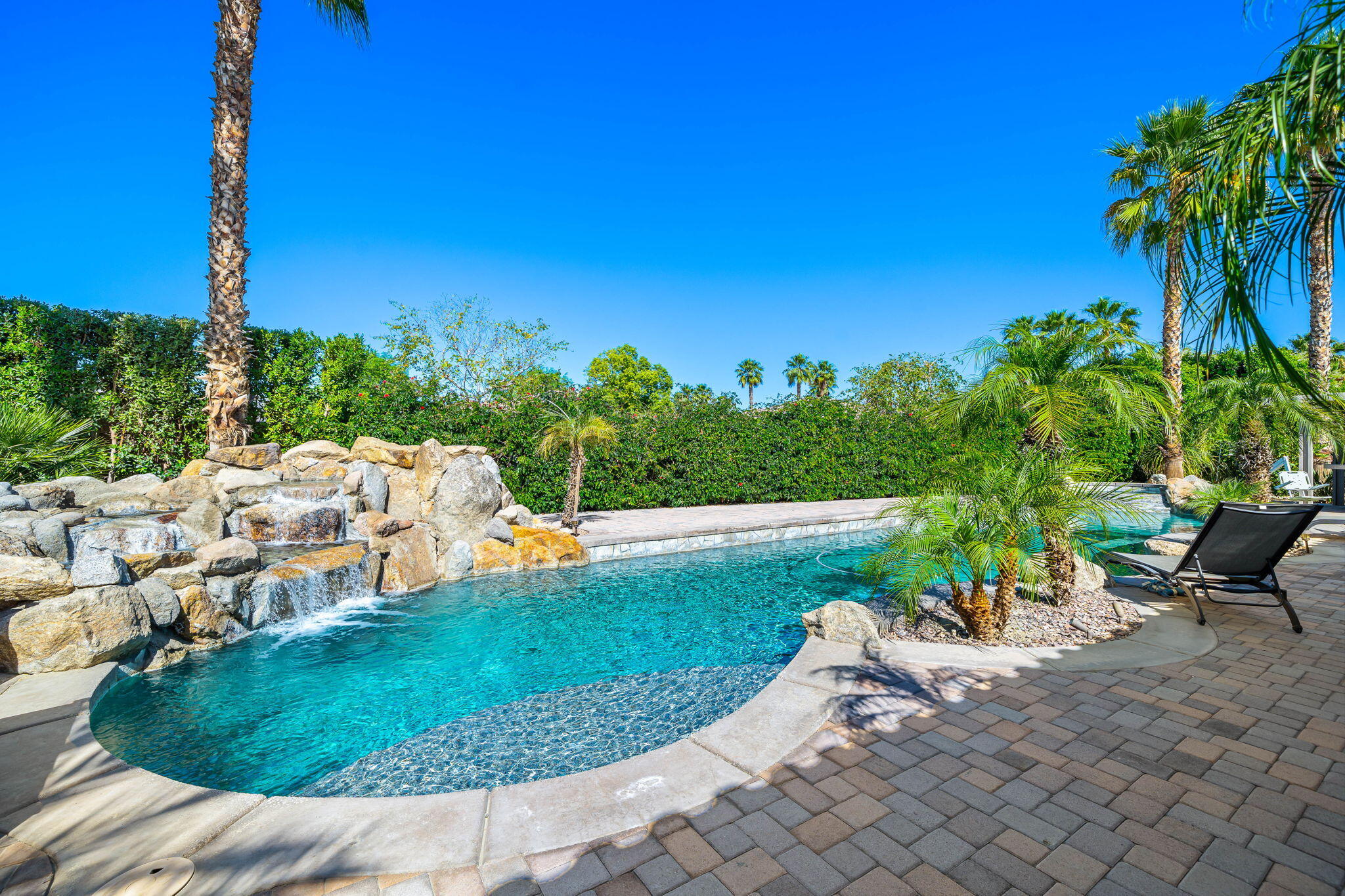 52455 Whispering Way La Quinta, CA 92253 - Photo 17 of 18 a view of a backyard with sitting area
