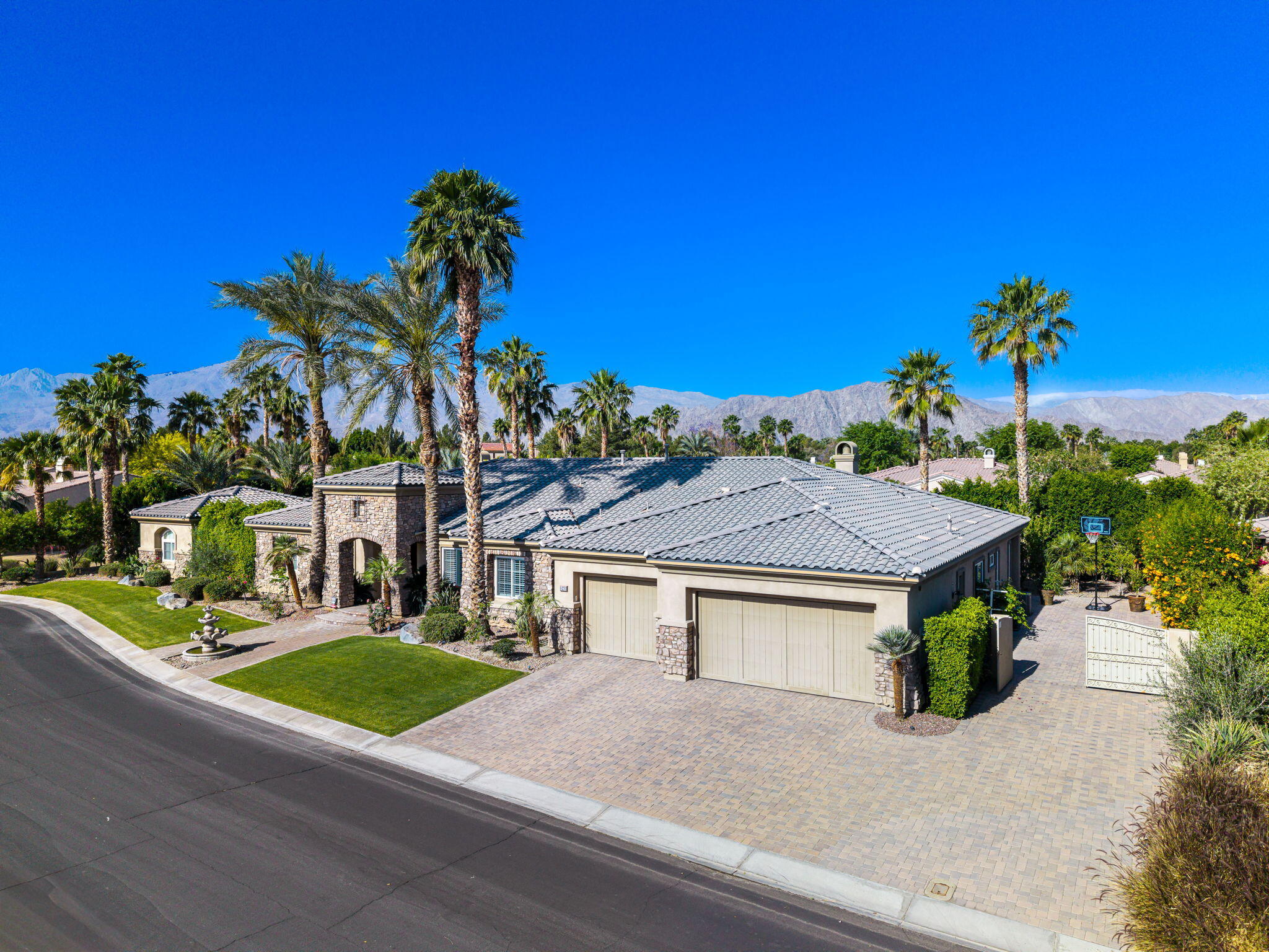 52455 Whispering Way La Quinta, CA 92253 - Photo 2 of 18 a view of house with outdoor space and garden