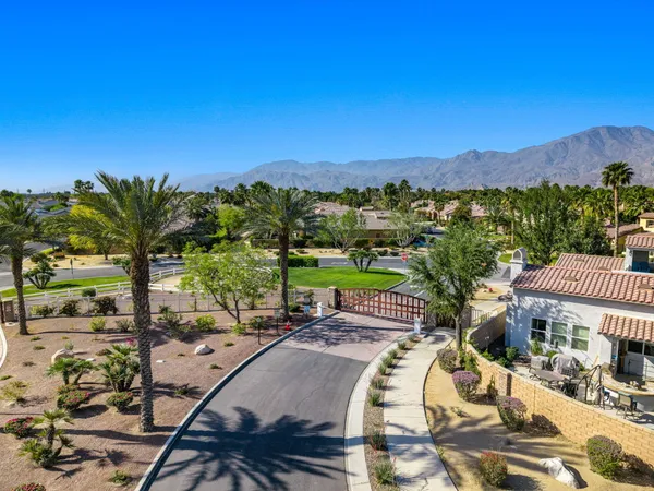 a view of a chairs and table in patio