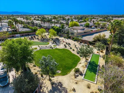 a view of a swimming pool with outdoor seating