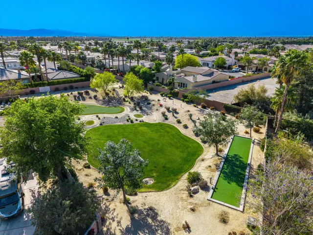 a view of a swimming pool with outdoor seating