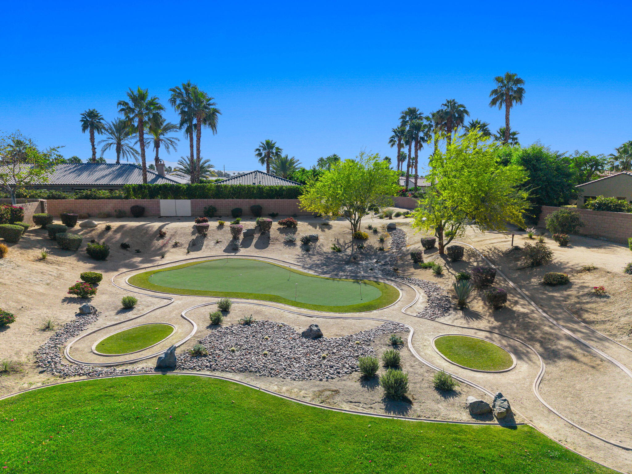 52455 Whispering Way La Quinta, CA 92253 - Photo 7 of 18 a view of a swimming pool with outdoor seating