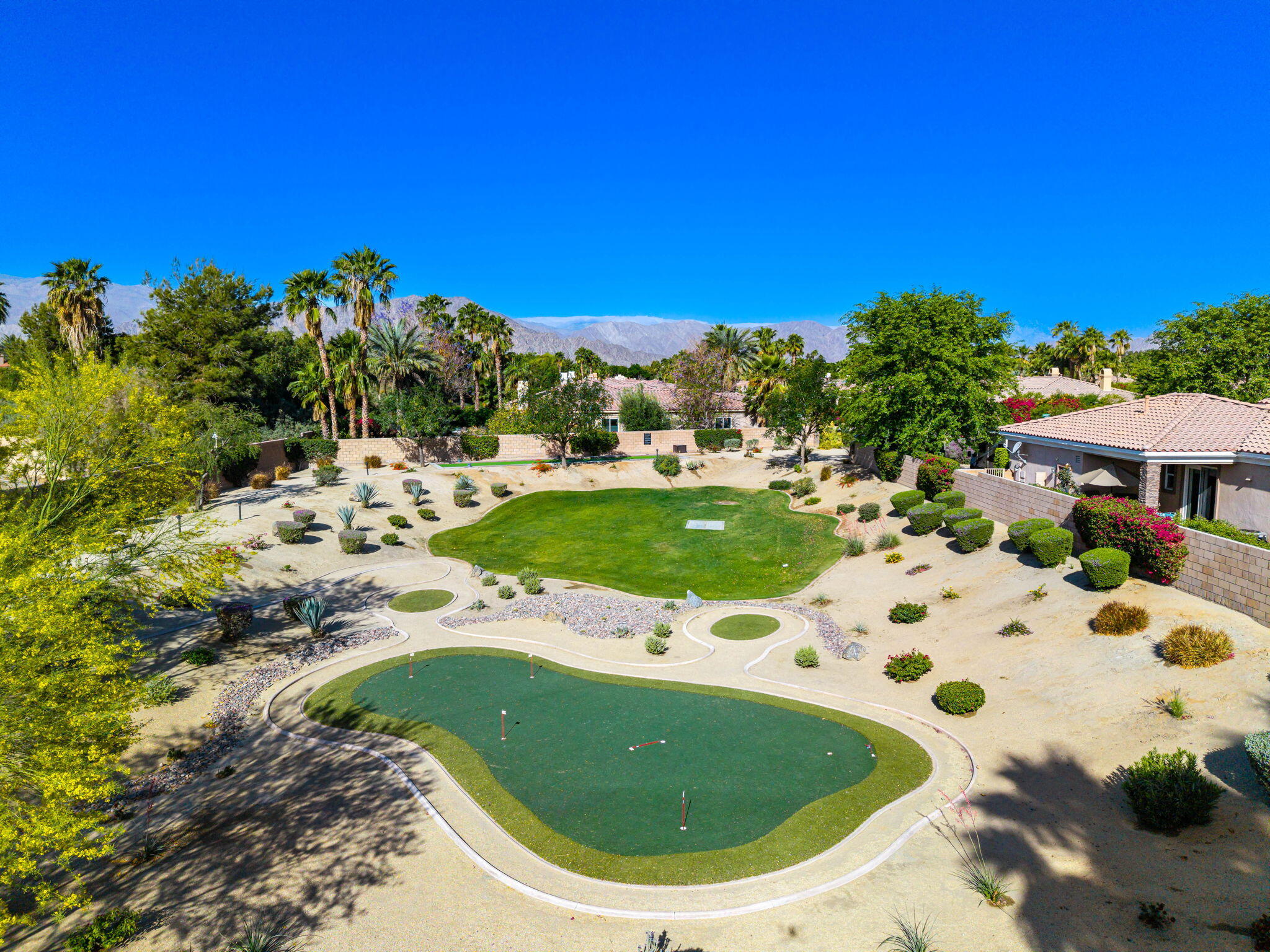 52455 Whispering Way La Quinta, CA 92253 - Photo 8 of 18 a view of a swimming pool with a yard