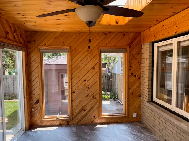 a view of a small room with wooden floor