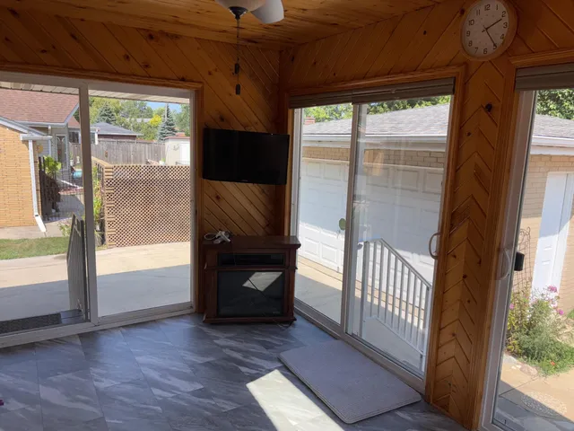 a view of front door and porch with wooden floor