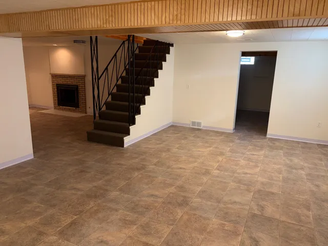 a view of a hallway with stairs