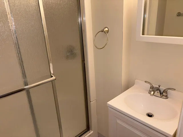 a bathroom with a sink and mirror