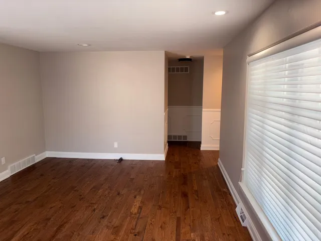 a view of wooden floor and brick walls