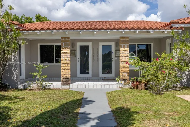 front view of a house with a yard