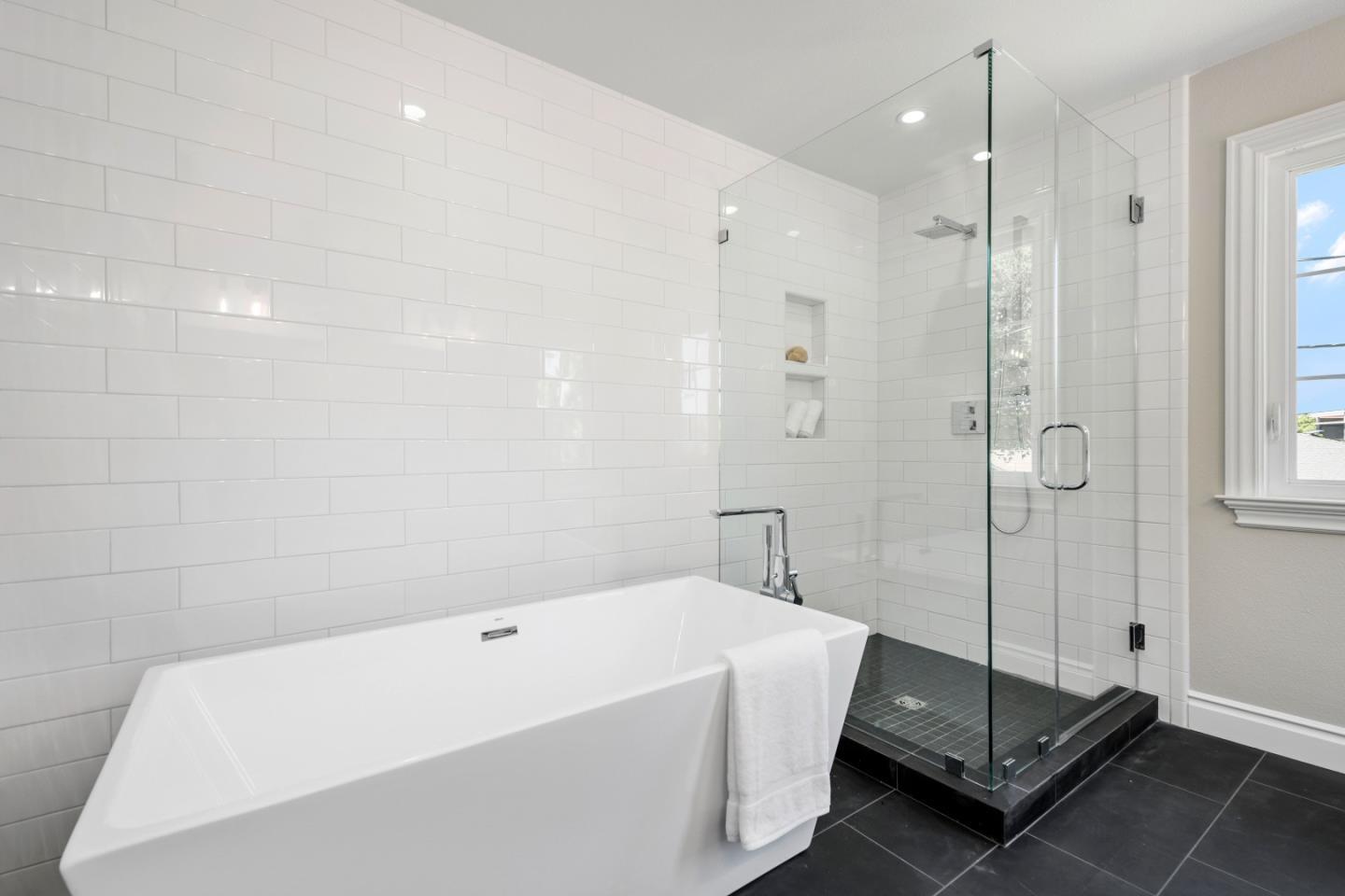 151 Giffin Road Los Altos, CA 94022 - Photo 29 of 44 a spacious bathroom with a tub shower and mirror