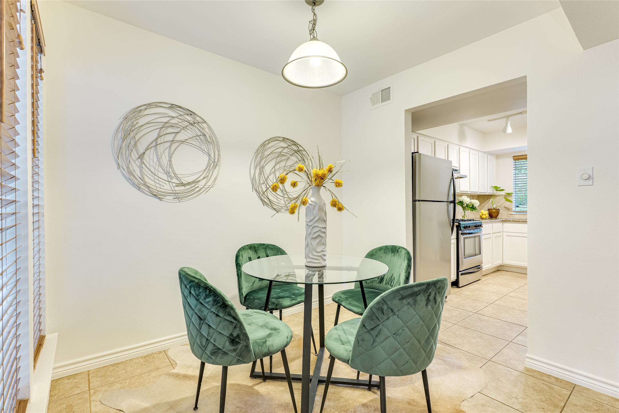 2500 Enfield Road, Unit 9 Austin, TX 78703 - Photo 8 of 26 Bright dining area just off the kitchen and living room, featuring double windows that flood the space with natural light while keeping it open and inviting.