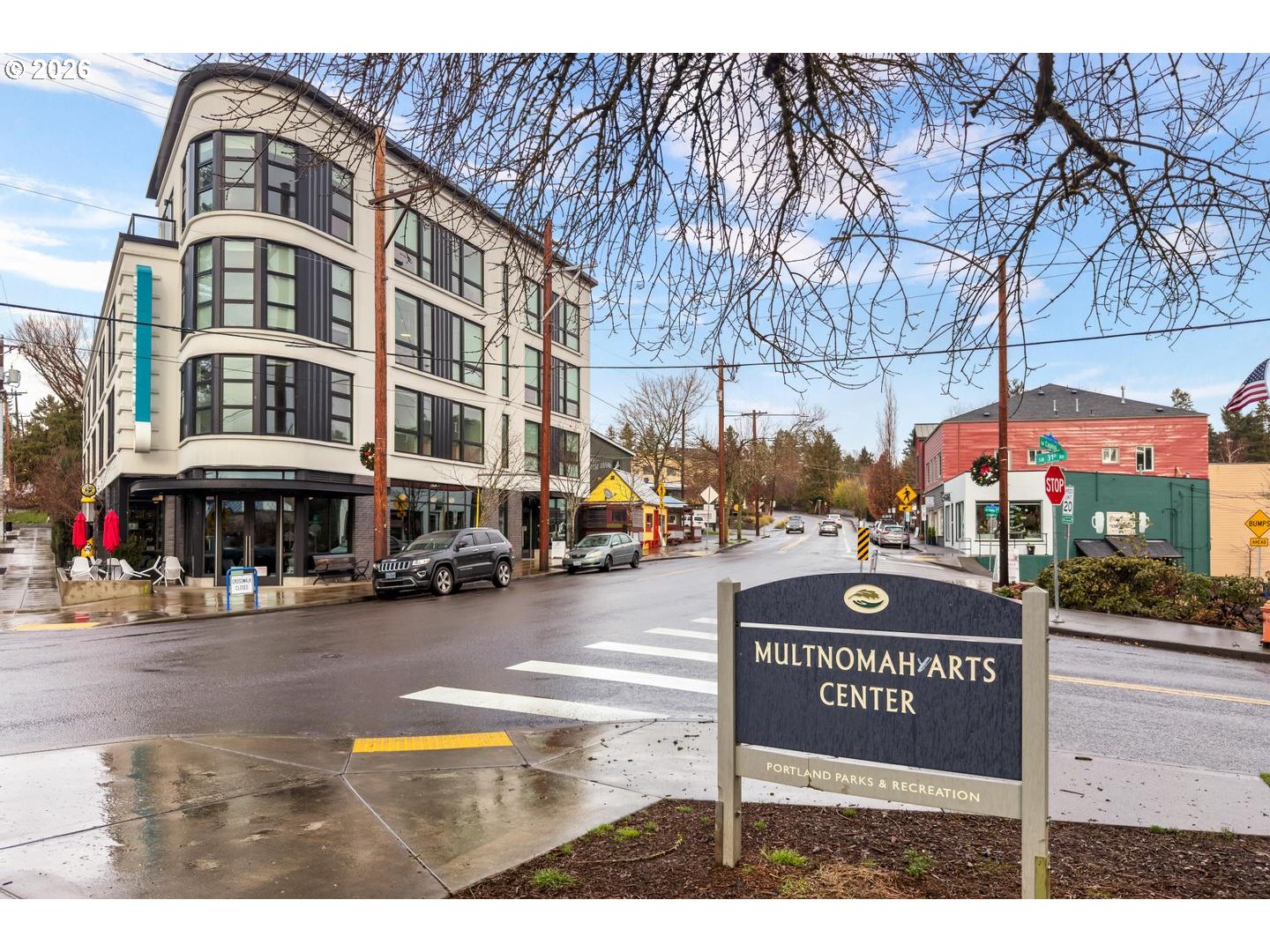 7910 Southwest 31st Avenue, Unit 203 Portland, OR 97219 - Photo 22 of 27 a view of a street with cars