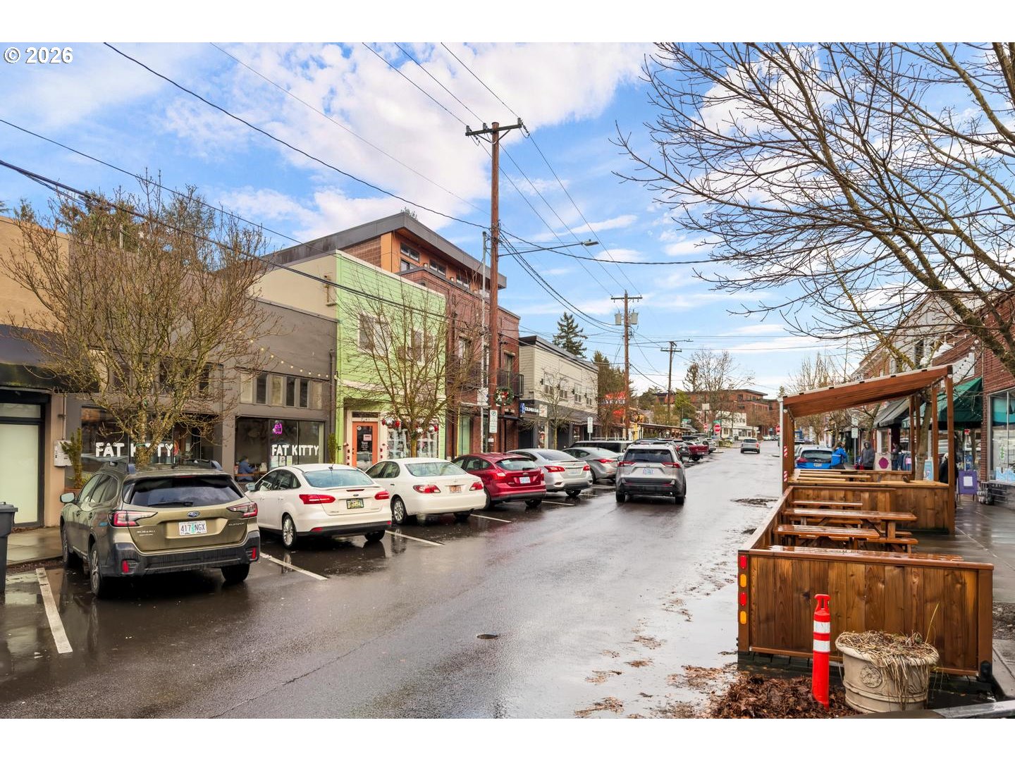 7910 Southwest 31st Avenue, Unit 203 Portland, OR 97219 - Photo 25 of 27 a view of city street with cars parked