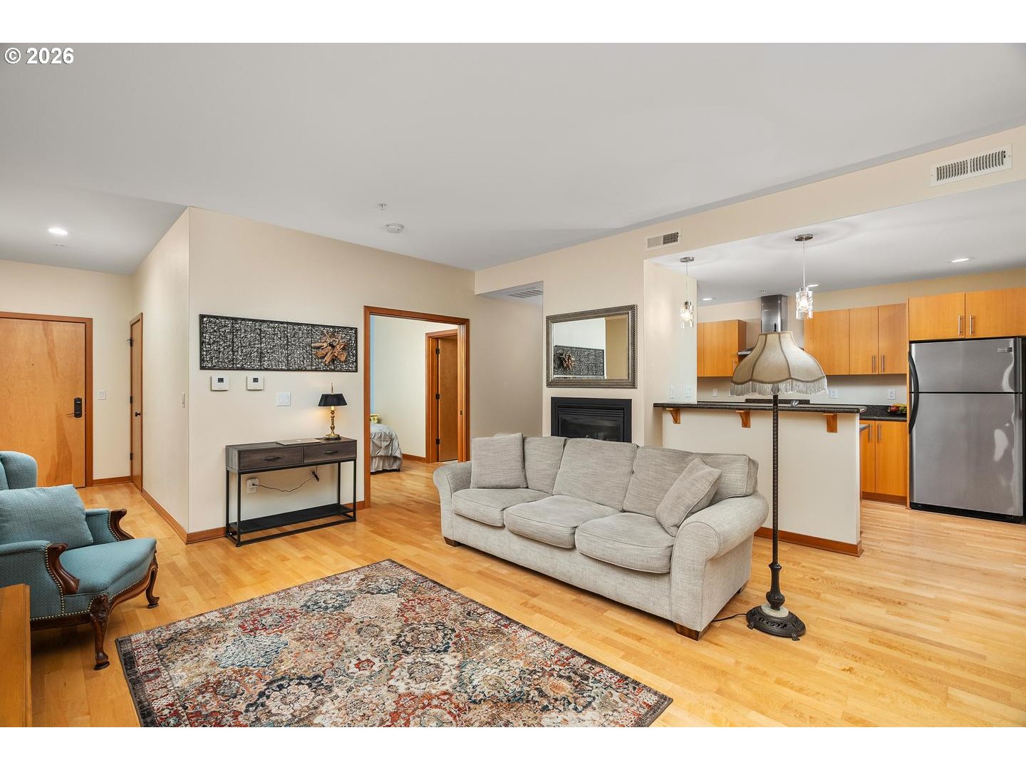 7910 Southwest 31st Avenue, Unit 203 Portland, OR 97219 - Photo 4 of 27 a living room with furniture and kitchen view