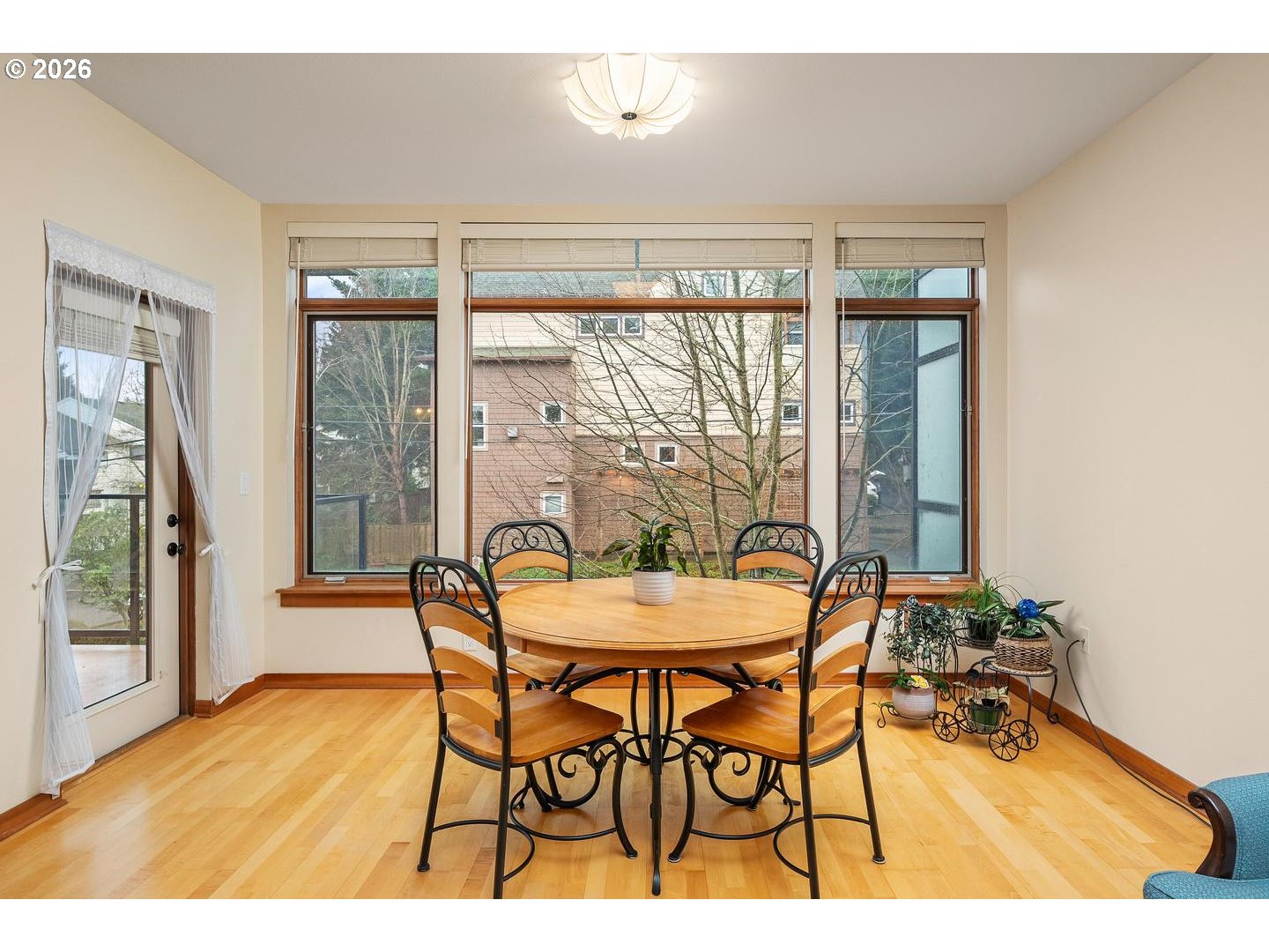 7910 Southwest 31st Avenue, Unit 203 Portland, OR 97219 - Photo 5 of 27 a dining room with furniture and large windows
