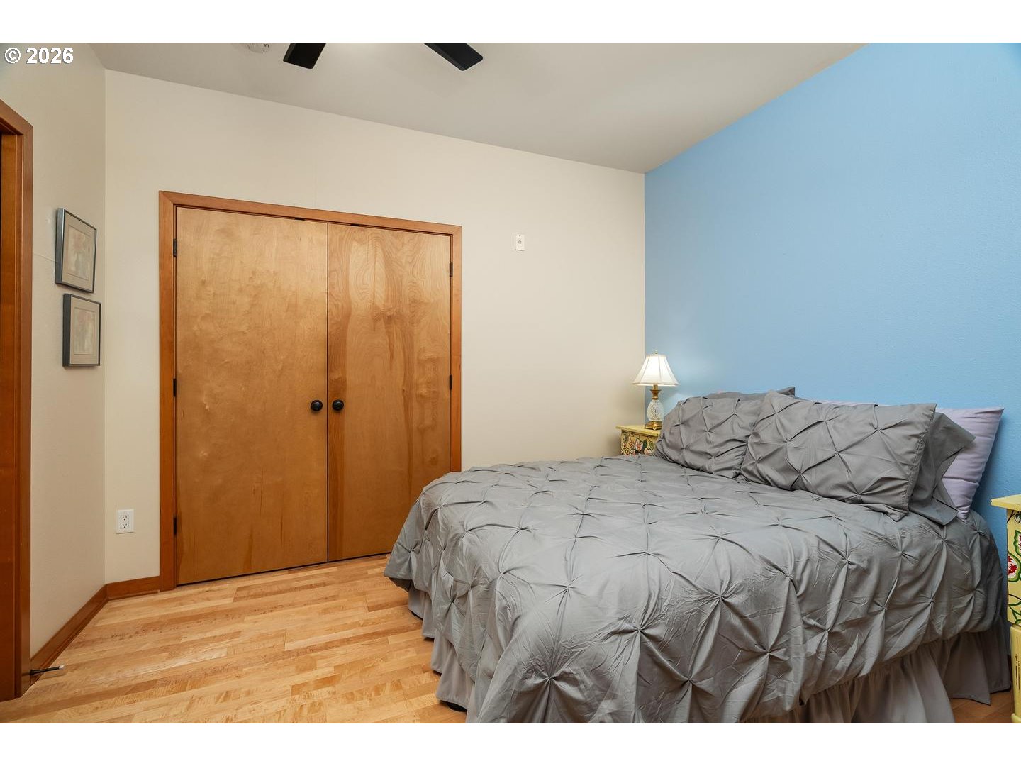 7910 Southwest 31st Avenue, Unit 203 Portland, OR 97219 - Photo 10 of 27 a bedroom with a bed and a cabinets