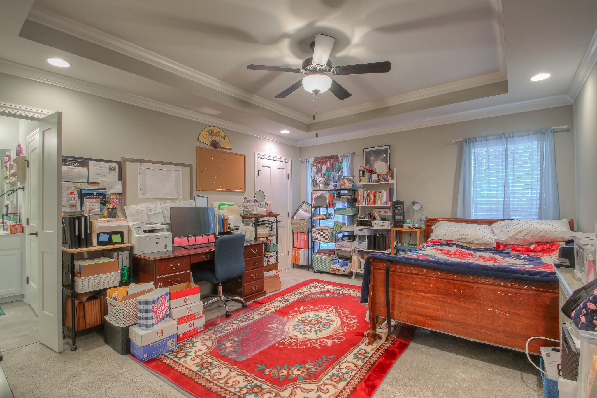 121 Flat Woods Road Lebanon, TN 37090 - Photo 11 of 39 a bed room with a bed and a book shelf