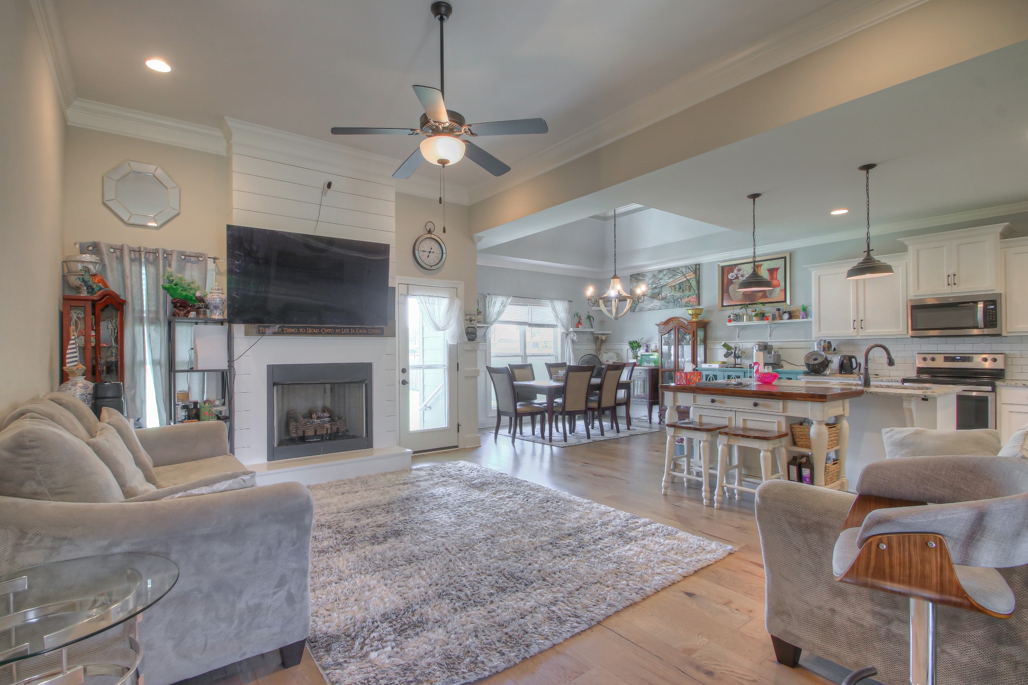 121 Flat Woods Road Lebanon, TN 37090 - Photo 2 of 39 a living room with furniture a fireplace and kitchen view