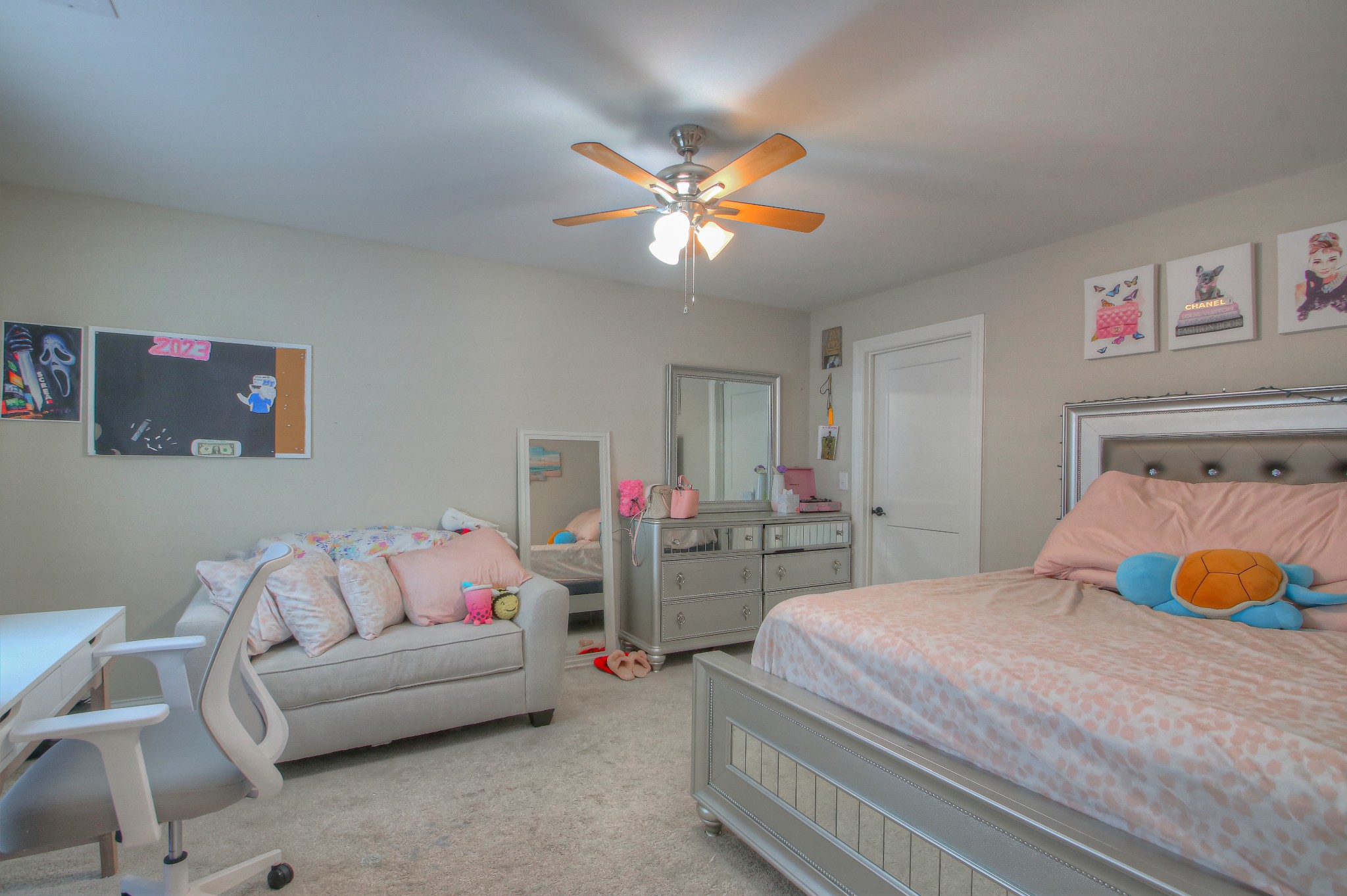 121 Flat Woods Road Lebanon, TN 37090 - Photo 23 of 39 a bedroom with a bed and a chandelier