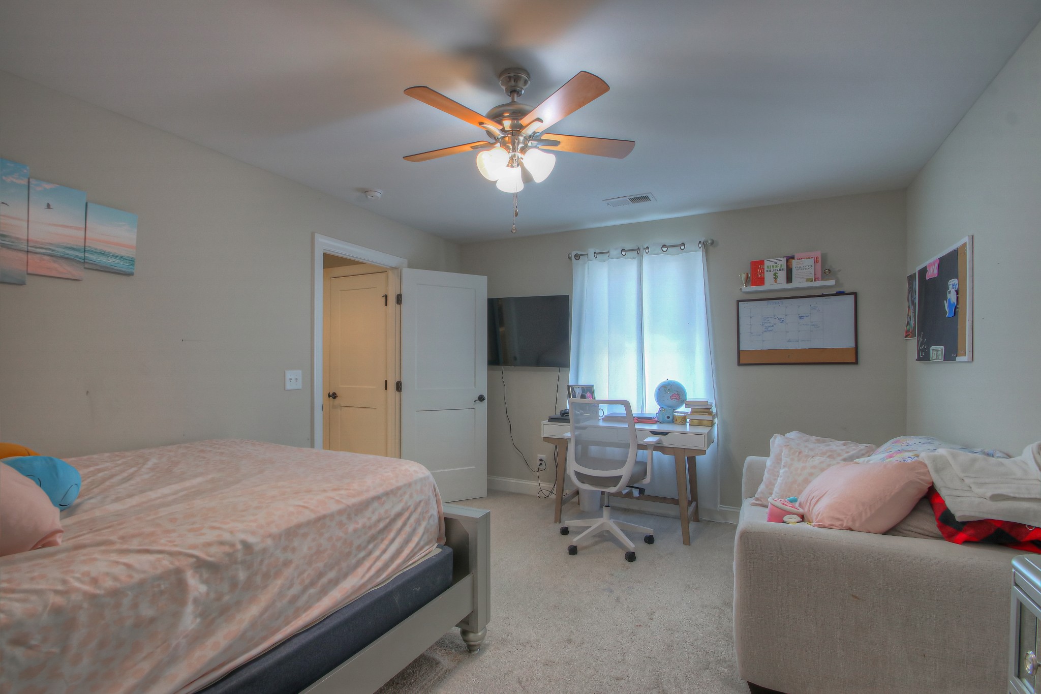 121 Flat Woods Road Lebanon, TN 37090 - Photo 24 of 39 a bedroom with a bed and a couch