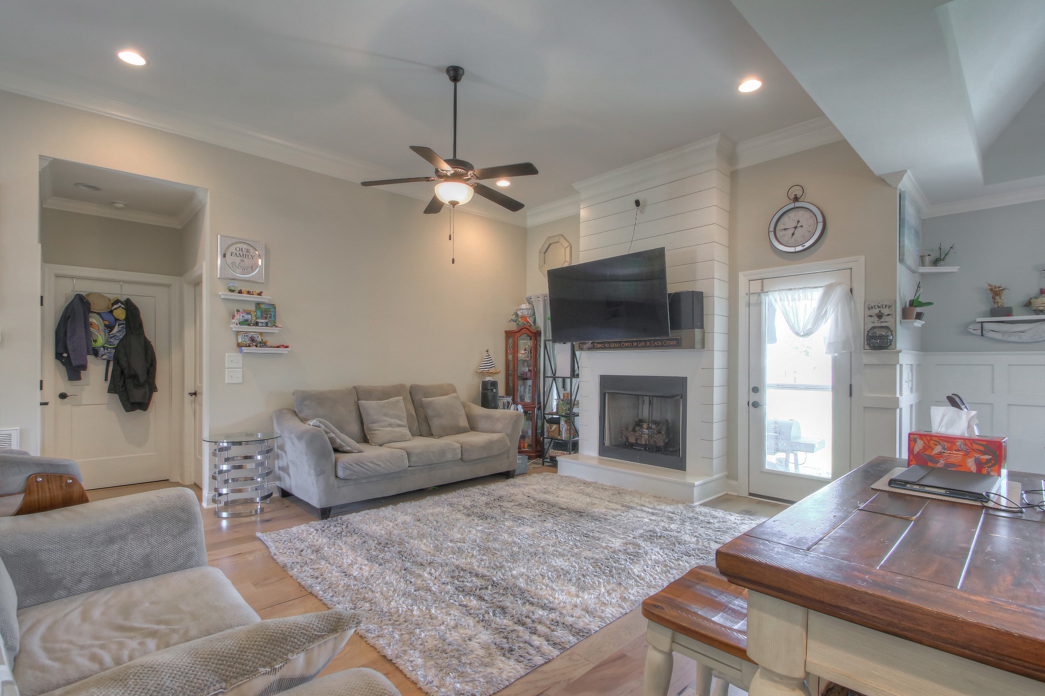 121 Flat Woods Road Lebanon, TN 37090 - Photo 3 of 39 a living room with furniture a fireplace and a flat screen tv