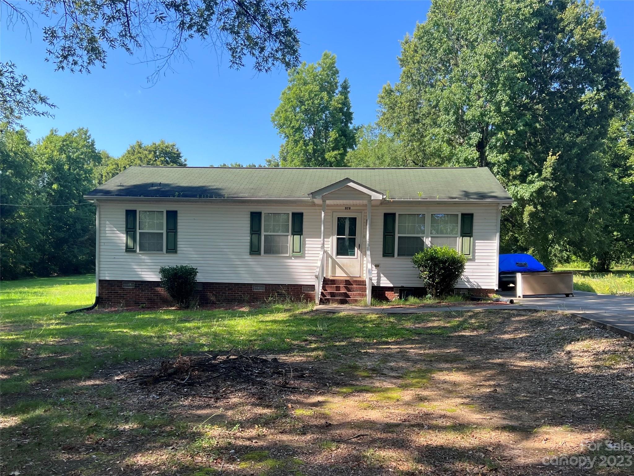 979 Yorkdale Road Chester, SC 29706 - Photo 1 of 1 a front view of a house with a yard porch and outdoor seating