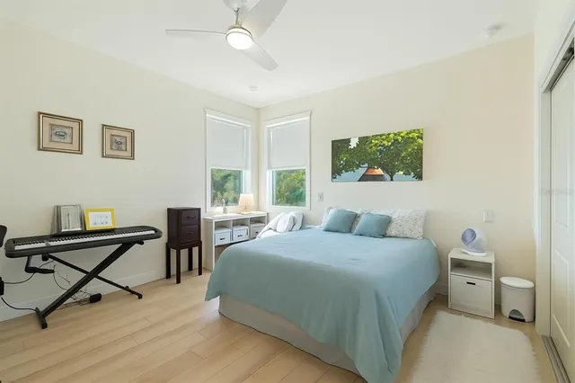 a bedroom with a bed and a desk