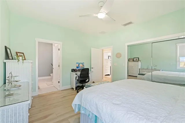 a bedroom with a bed and a dresser