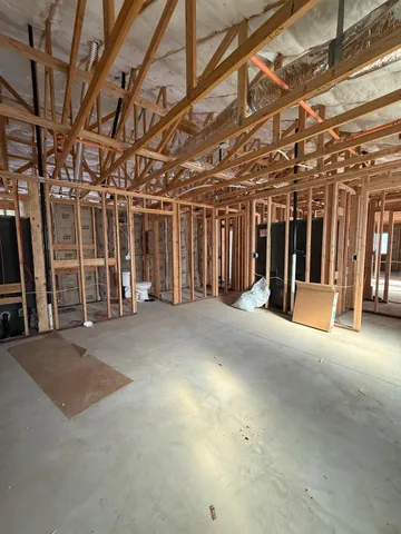 a view of a room with wooden walls